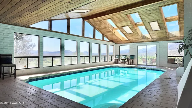 a view of a swimming pool with seating area