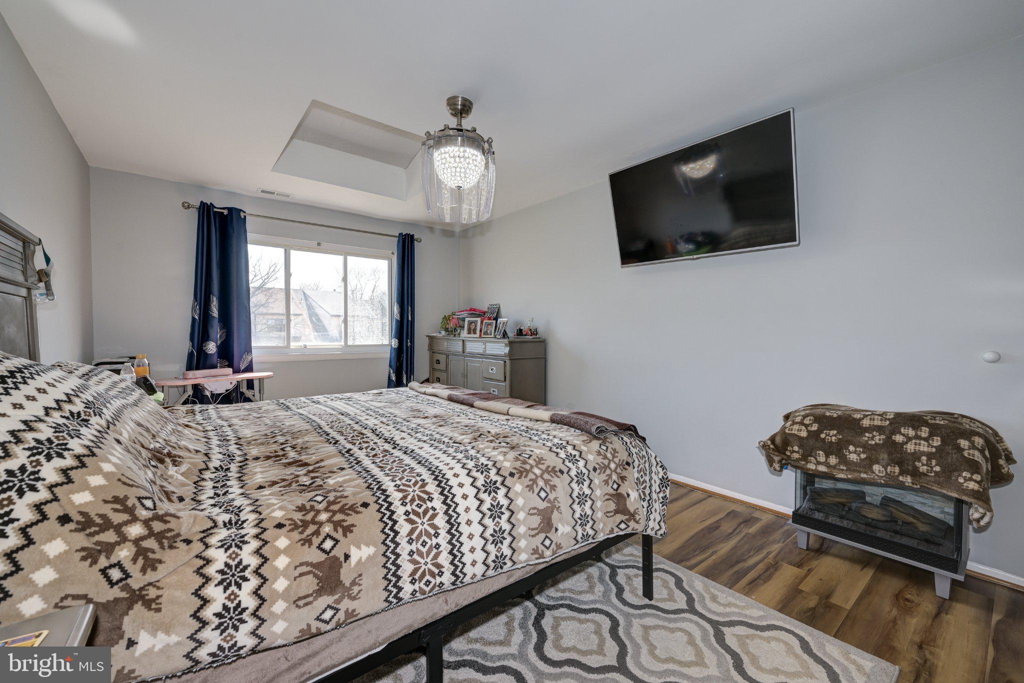 75 Sandra Road Voorhees, NJ 08043 - Photo 16 of 25 a bedroom with a bed and a flat screen tv