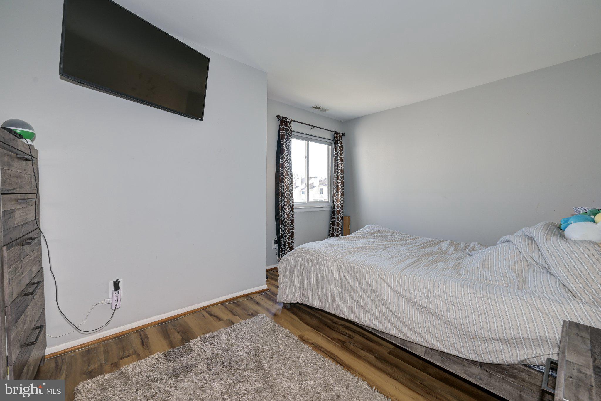 75 Sandra Road Voorhees, NJ 08043 - Photo 21 of 25 a bedroom with a bed and a flat screen tv
