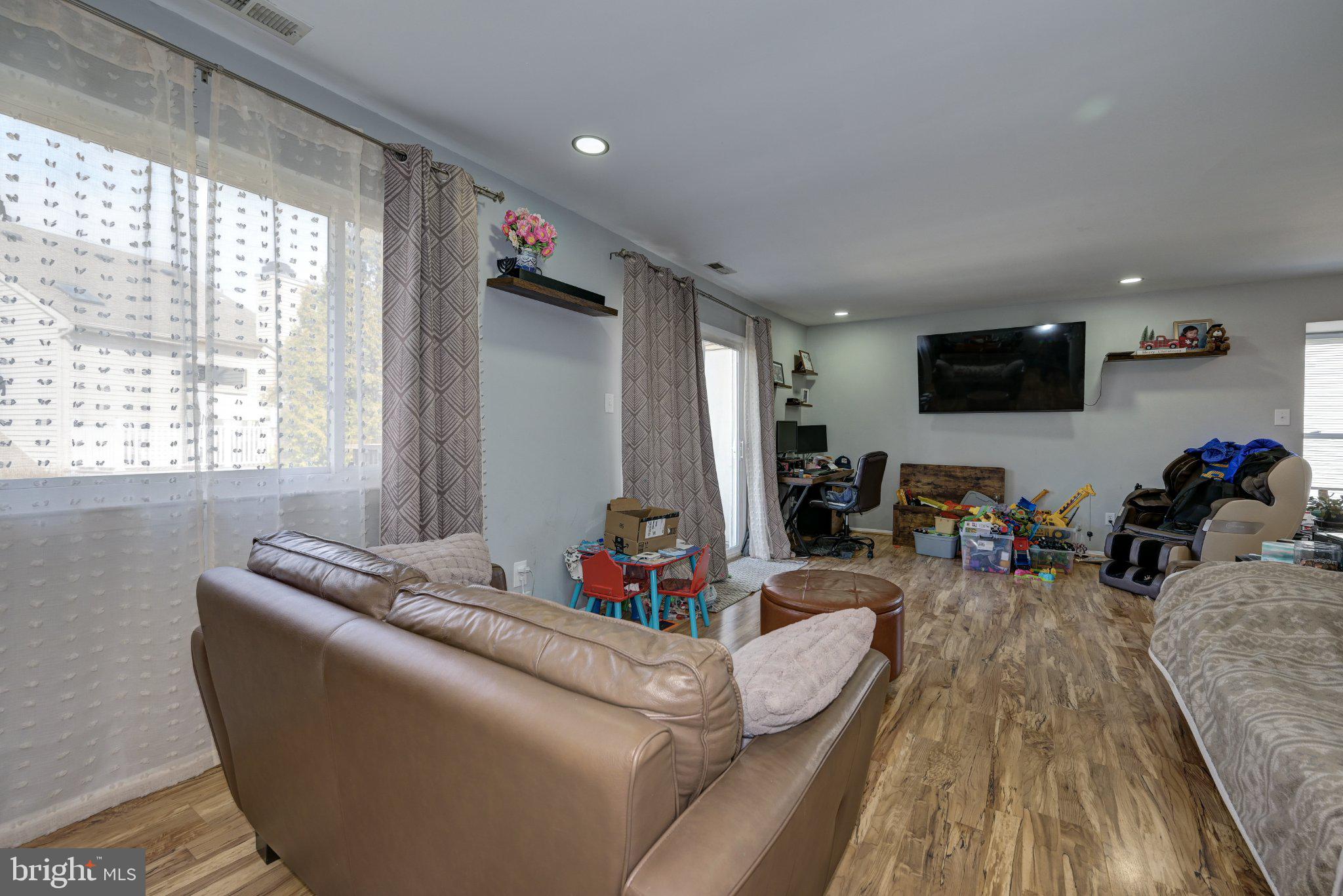 75 Sandra Road Voorhees, NJ 08043 - Photo 7 of 25 a living room with furniture and a flat screen tv