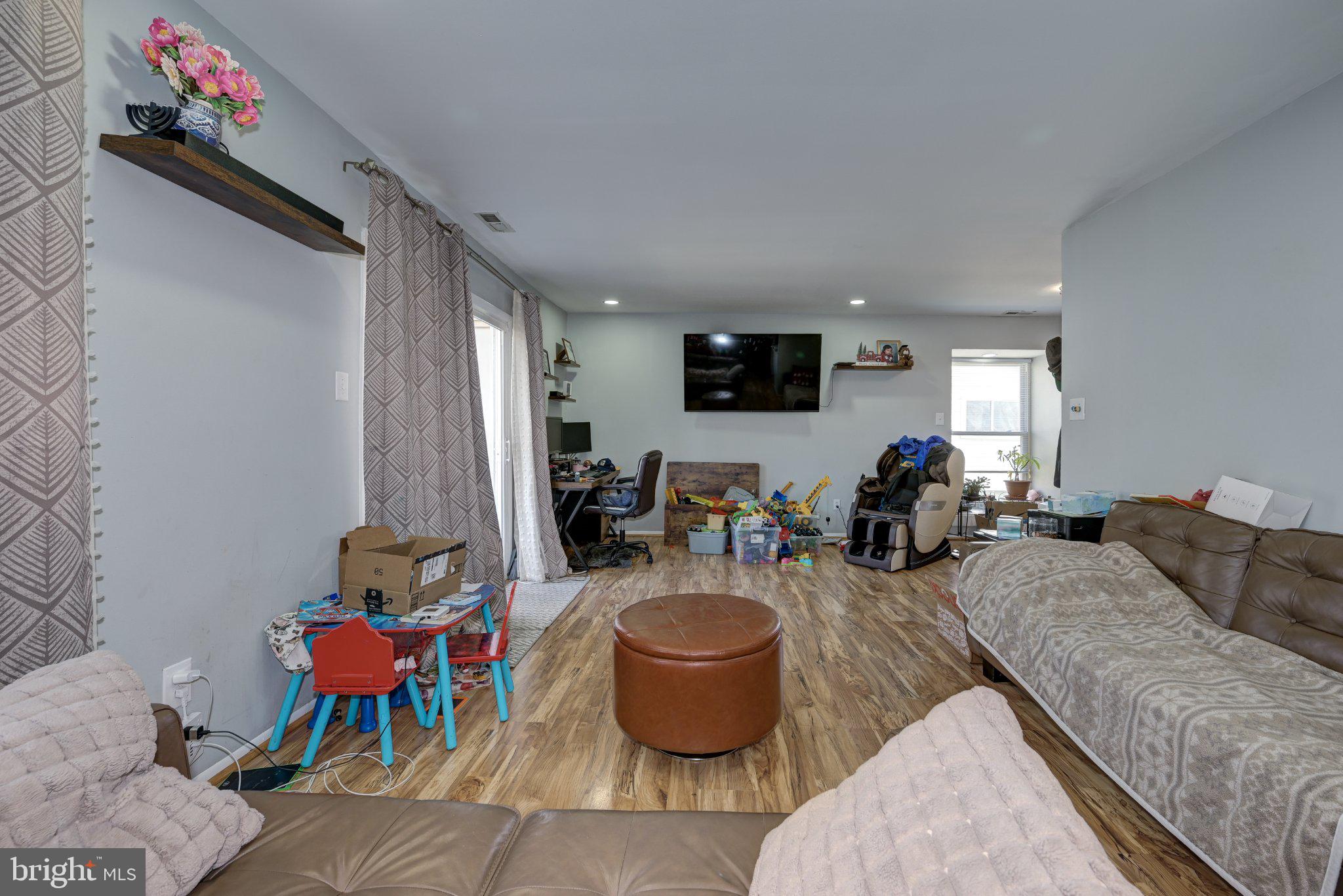 75 Sandra Road Voorhees, NJ 08043 - Photo 8 of 25 a living room with furniture and a flat screen tv