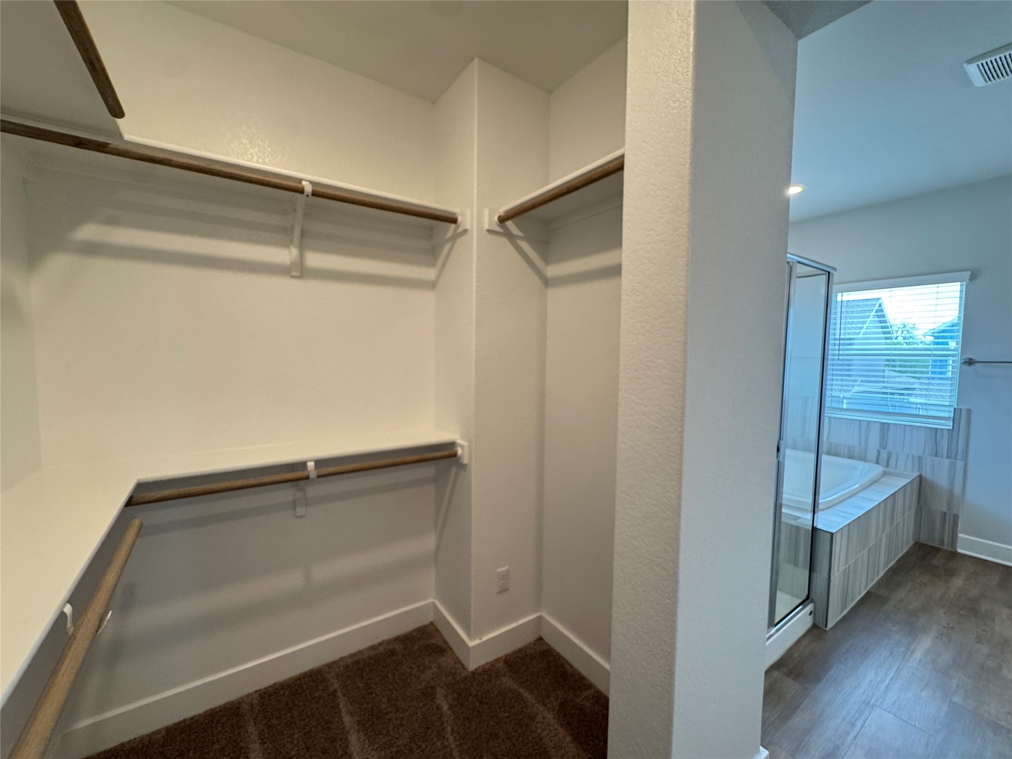 3000 Chisholm Trail Road, Unit 33 Round Rock, TX 78681 - Photo 21 of 31 a view of walk in closet with empty racks