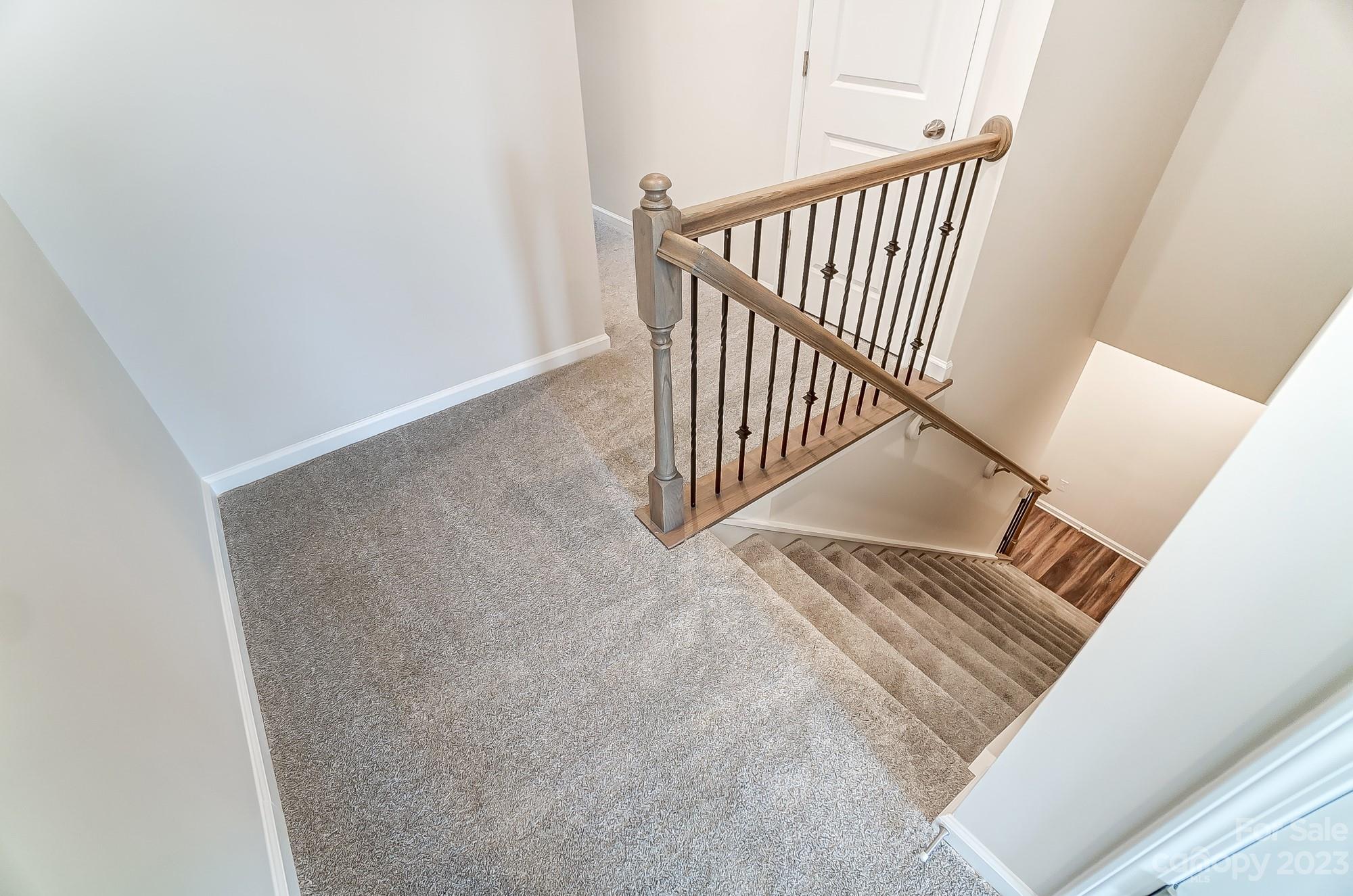 15317 Braid Mdw Drive, Unit 170 Charlotte, NC 28278 - Photo 15 of 29 a view of a hallway with staircase