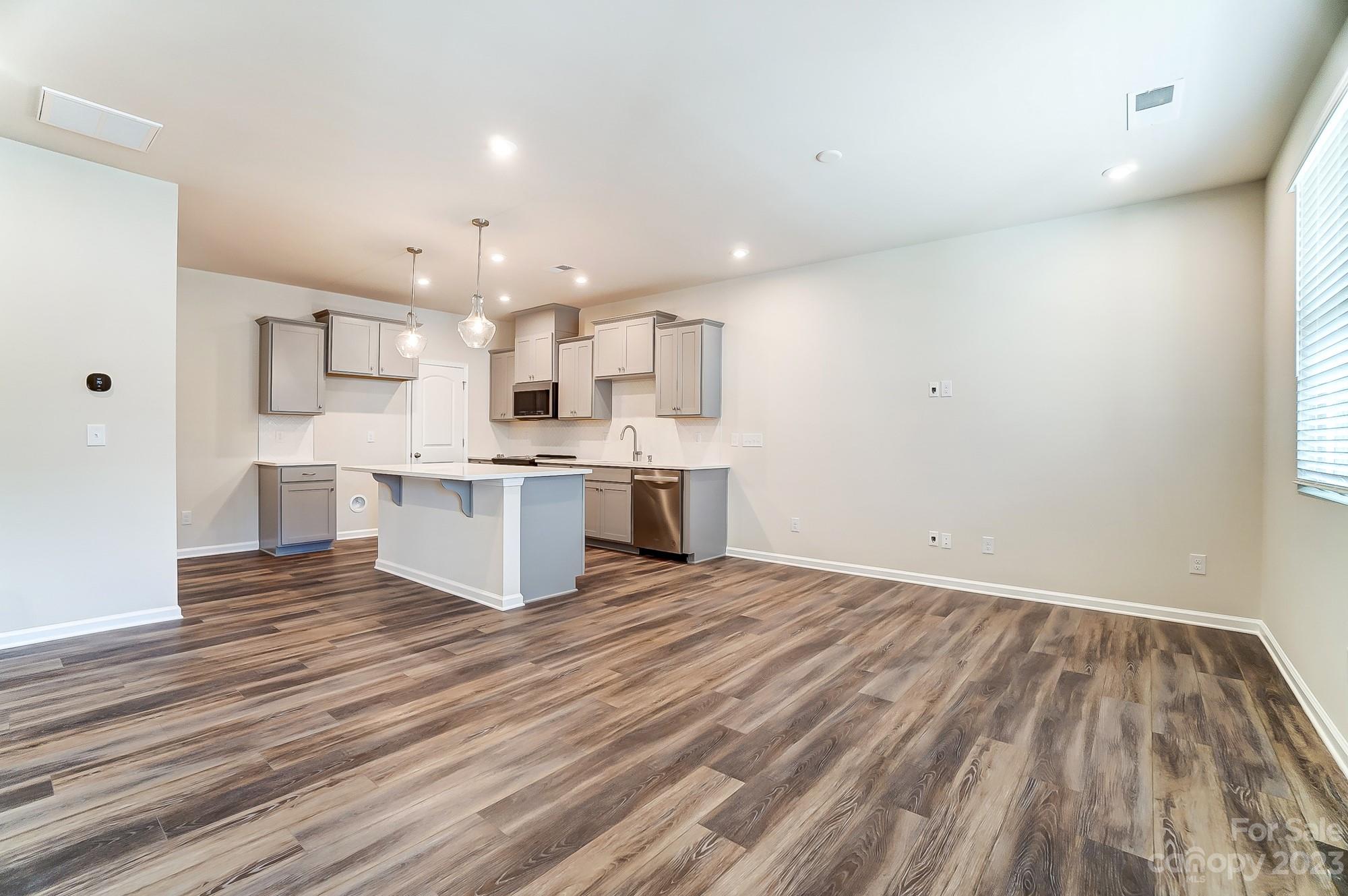 15317 Braid Mdw Drive, Unit 170 Charlotte, NC 28278 - Photo 17 of 29 a view of kitchen with wooden floor and electronic appliances