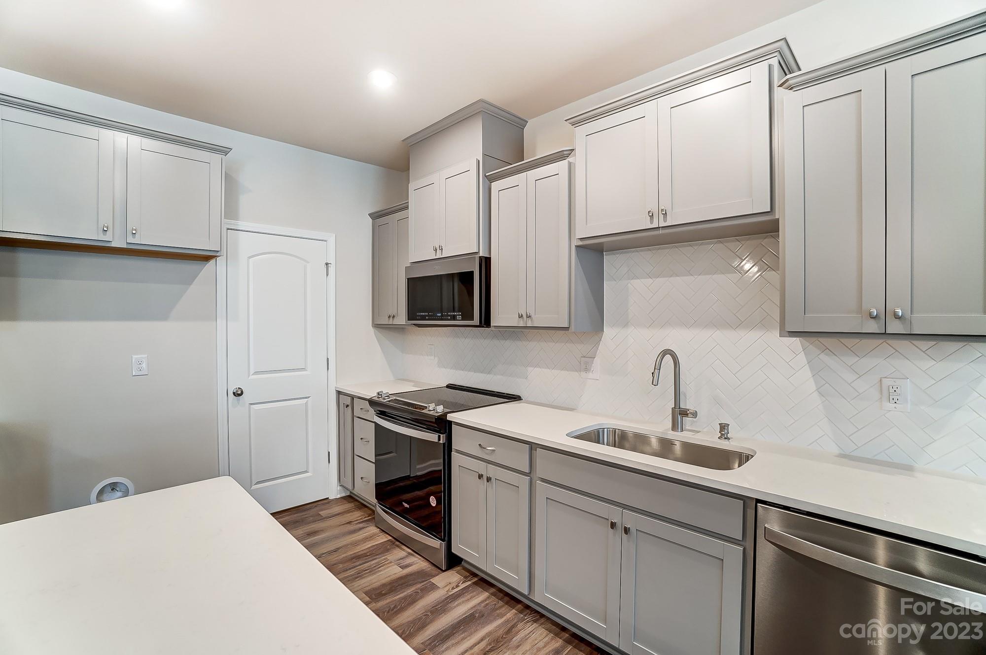 15317 Braid Mdw Drive, Unit 170 Charlotte, NC 28278 - Photo 18 of 29 a kitchen with a sink cabinets and appliances