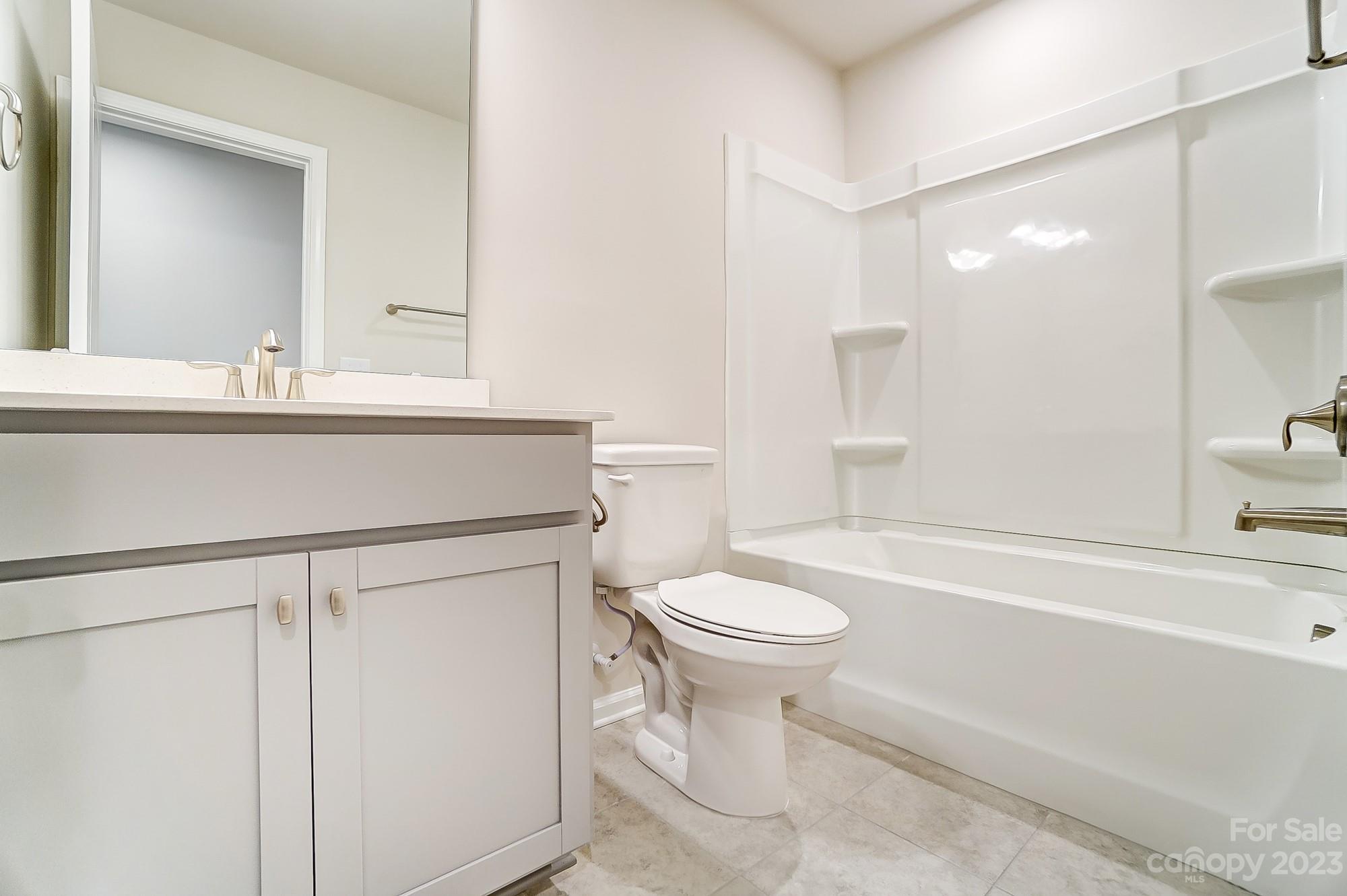 15317 Braid Mdw Drive, Unit 170 Charlotte, NC 28278 - Photo 21 of 29 a bathroom with a sink toilet a mirror and shower