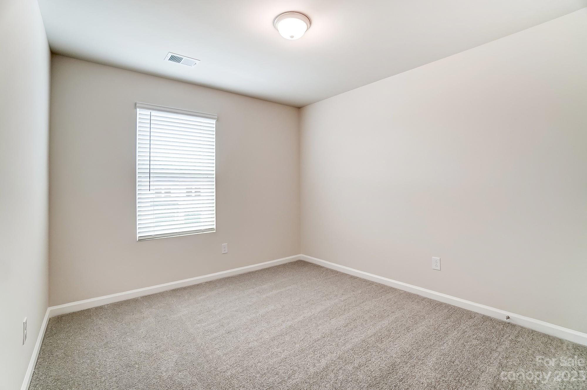 15317 Braid Mdw Drive, Unit 170 Charlotte, NC 28278 - Photo 23 of 29 an empty room with a window