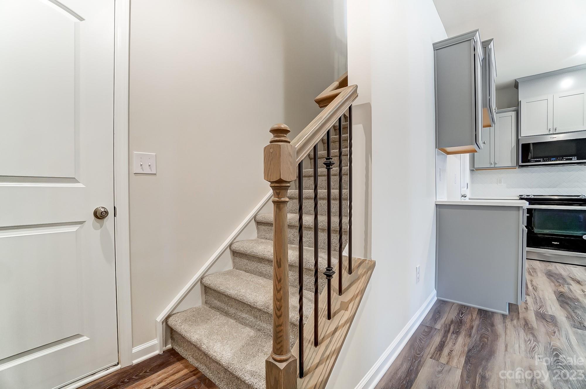 15317 Braid Mdw Drive, Unit 170 Charlotte, NC 28278 - Photo 5 of 29 a view of entryway and kitchen with wooden floor