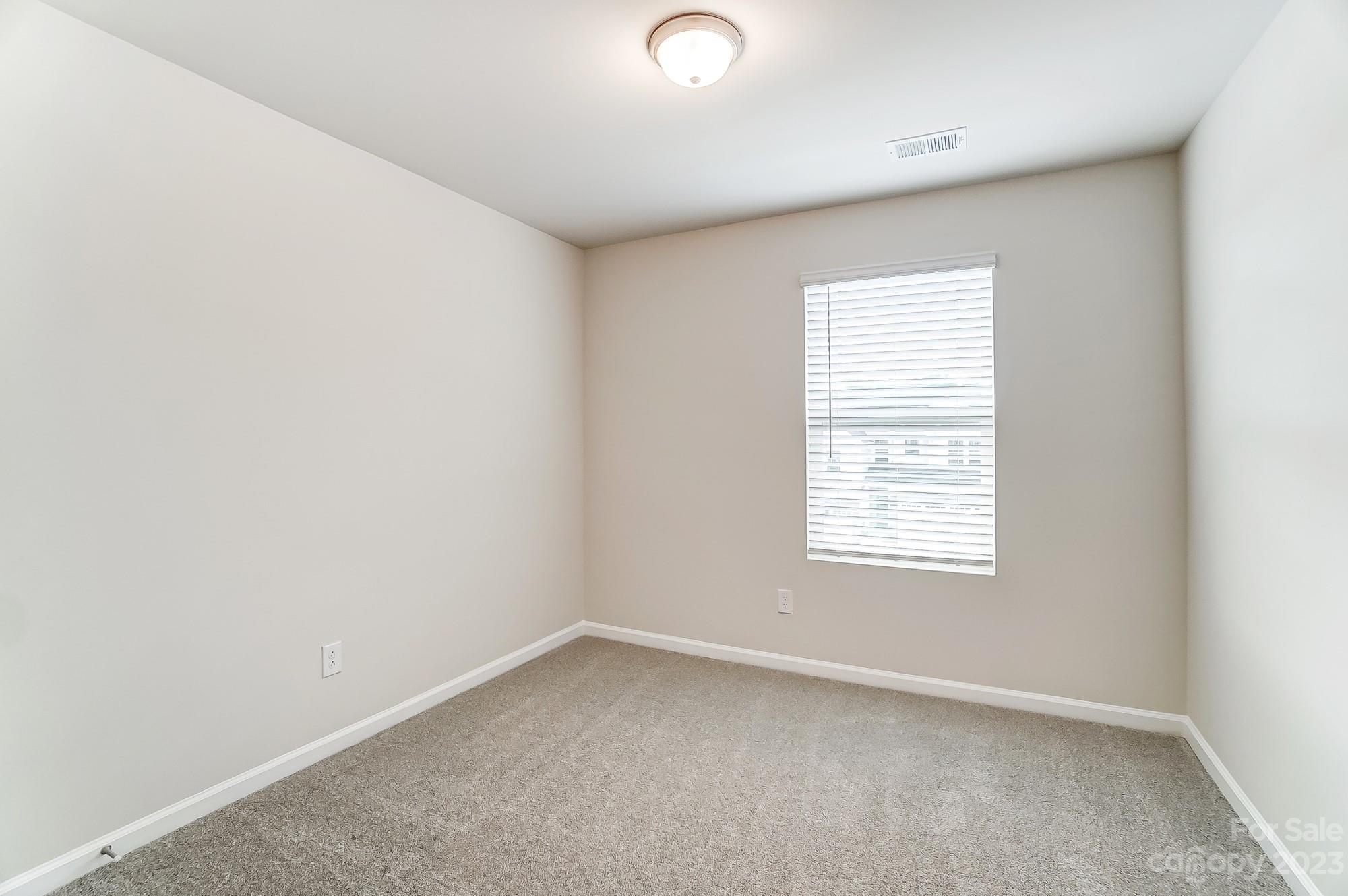 15317 Braid Mdw Drive, Unit 170 Charlotte, NC 28278 - Photo 10 of 29 an empty room with a window