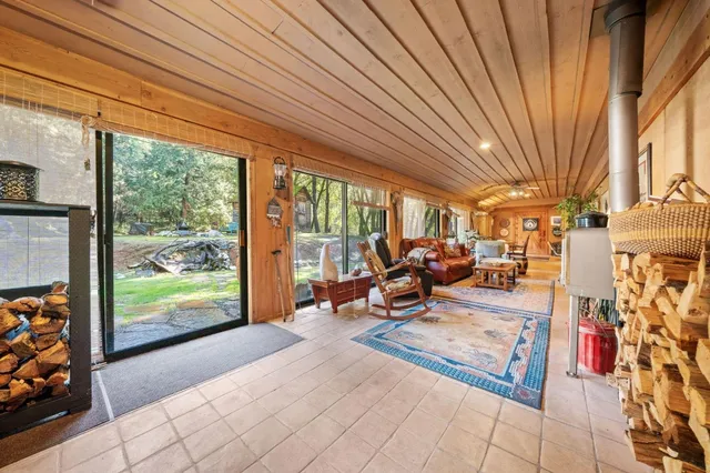 a bed room with a bed and chair