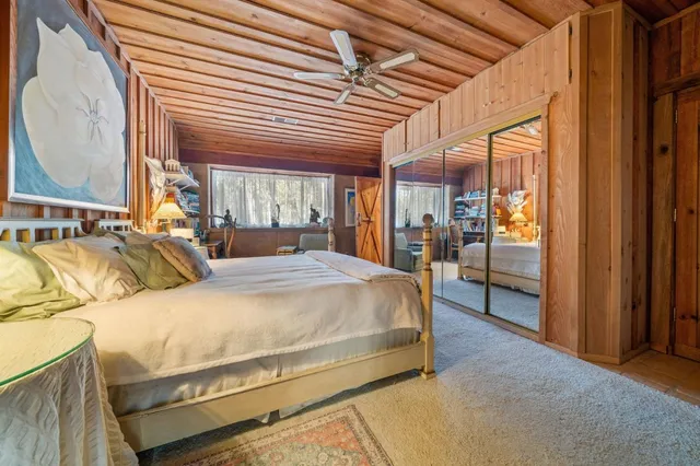 a view of a backyard with table and chairs