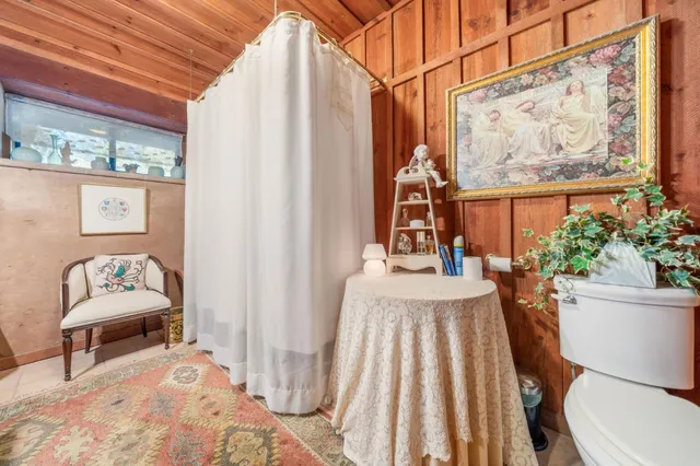 a view of a backyard with table and chairs and a fire pit