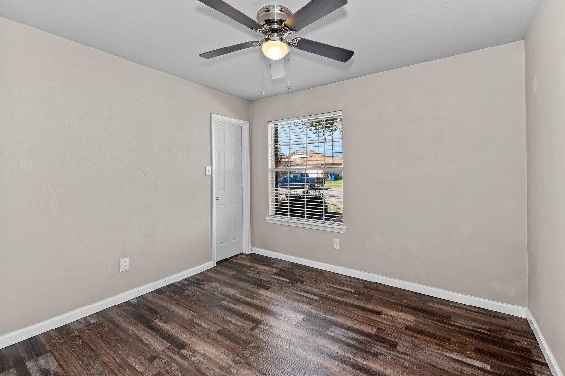 2201 Whistling Way Taylor, TX 76574 - Photo 6 of 40 a view of an empty room with window and chandelier fan