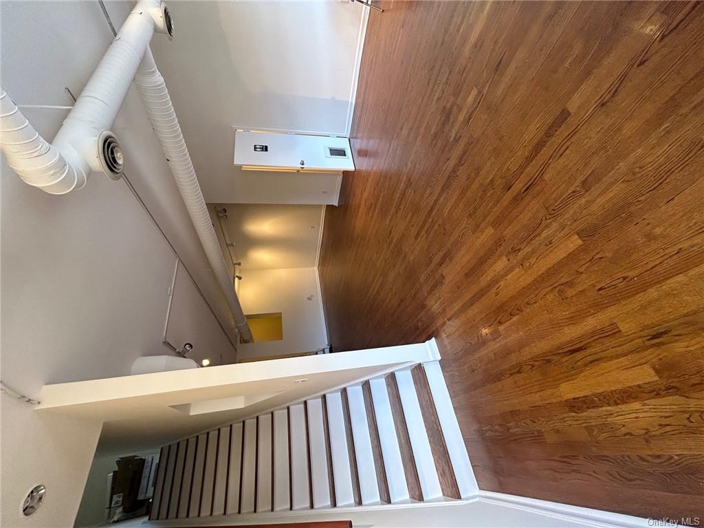 25 South Division Street Peekskill, NY 10566 - Photo 5 of 20 Unfurnished living room with dark hardwood / wood-style floors