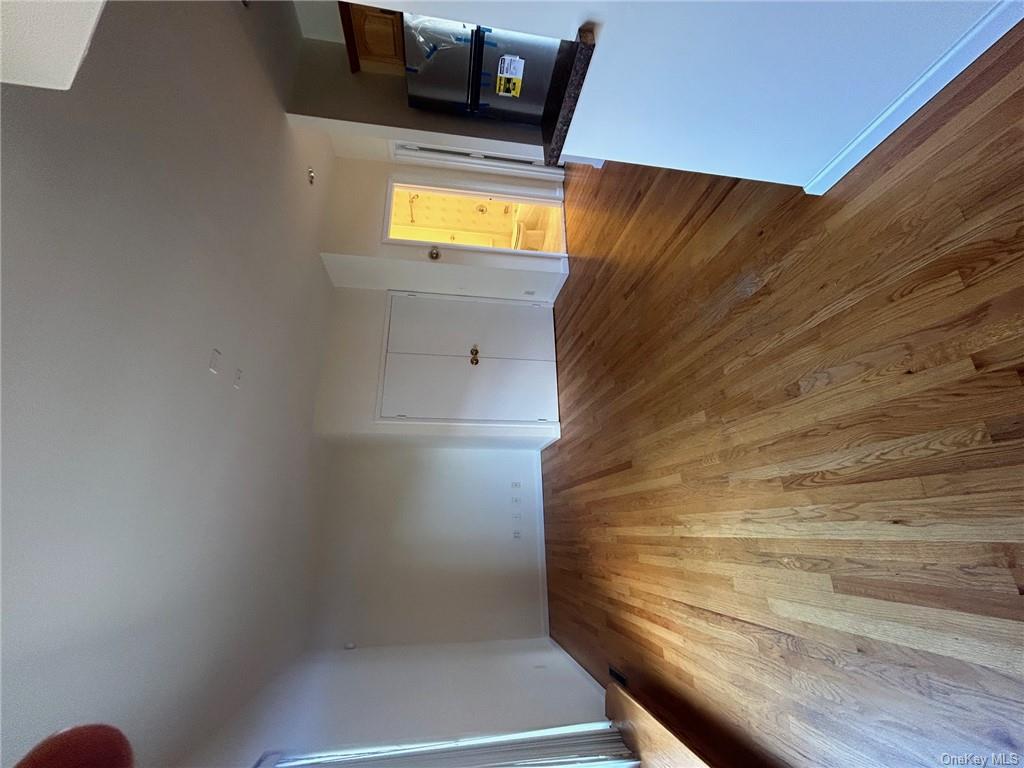 25 South Division Street Peekskill, NY 10566 - Photo 9 of 20 Unfurnished living room with light hardwood / wood-style flooring