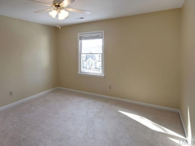 8404 Grey Abbey Place Raleigh, NC 27615 - Photo 11 of 12 Another large secondary bedroom with new carpet and a brand new ceiling fan!