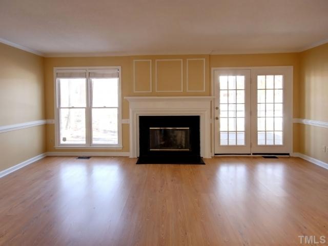 Large family room with fresh paint, hardwood floors, unique trim, gas fireplace, and even french doors to your fabulous french doors!!!  Even blinds on your windows before you even move in!!!
