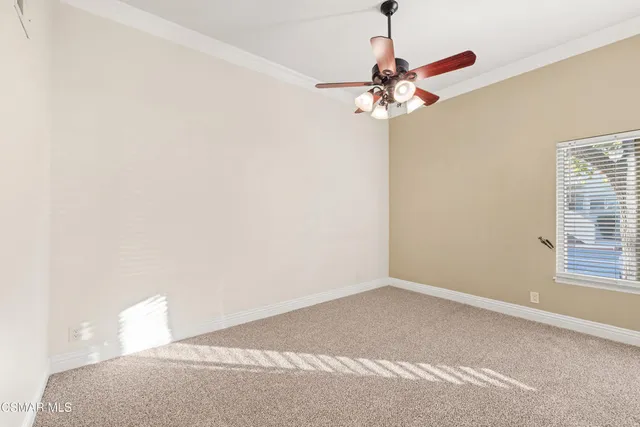 a view of a chandelier fan in a room