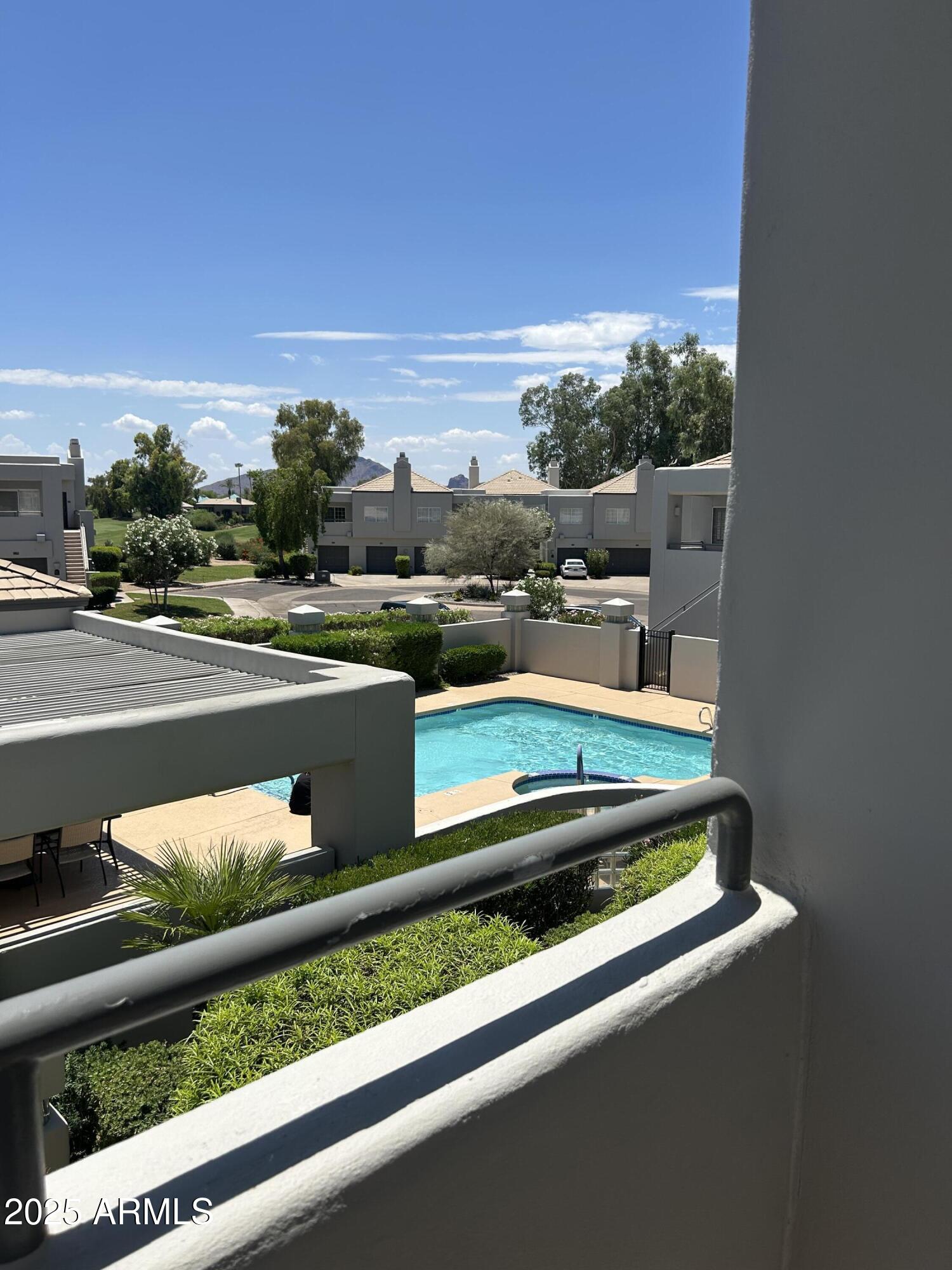 7710 East Gainey Ranch Road, Unit 211 Scottsdale, AZ 85258 - Photo 25 of 45 POOL VIEW FROM MASTER PATIO