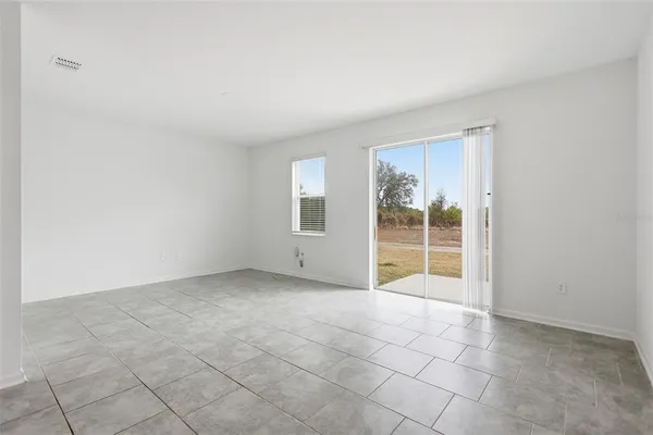 a view of an empty room with stairs