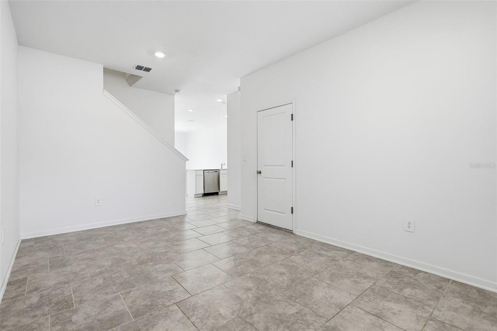 3303 Laurent Loop Davenport, FL 33837 - Photo 15 of 37 an empty room with cabinet and mirrors