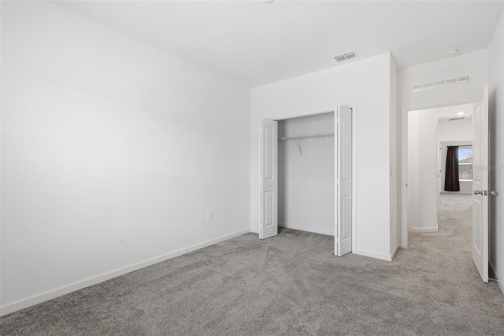3303 Laurent Loop Davenport, FL 33837 - Photo 22 of 37 an empty room with closet