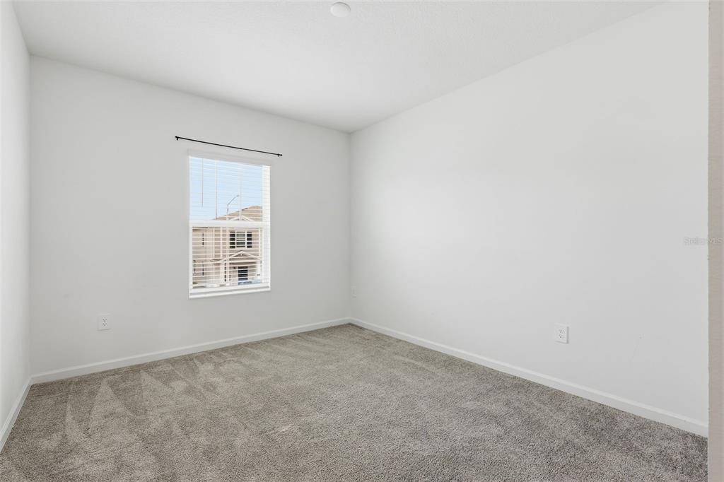 3303 Laurent Loop Davenport, FL 33837 - Photo 23 of 37 an empty room with a window