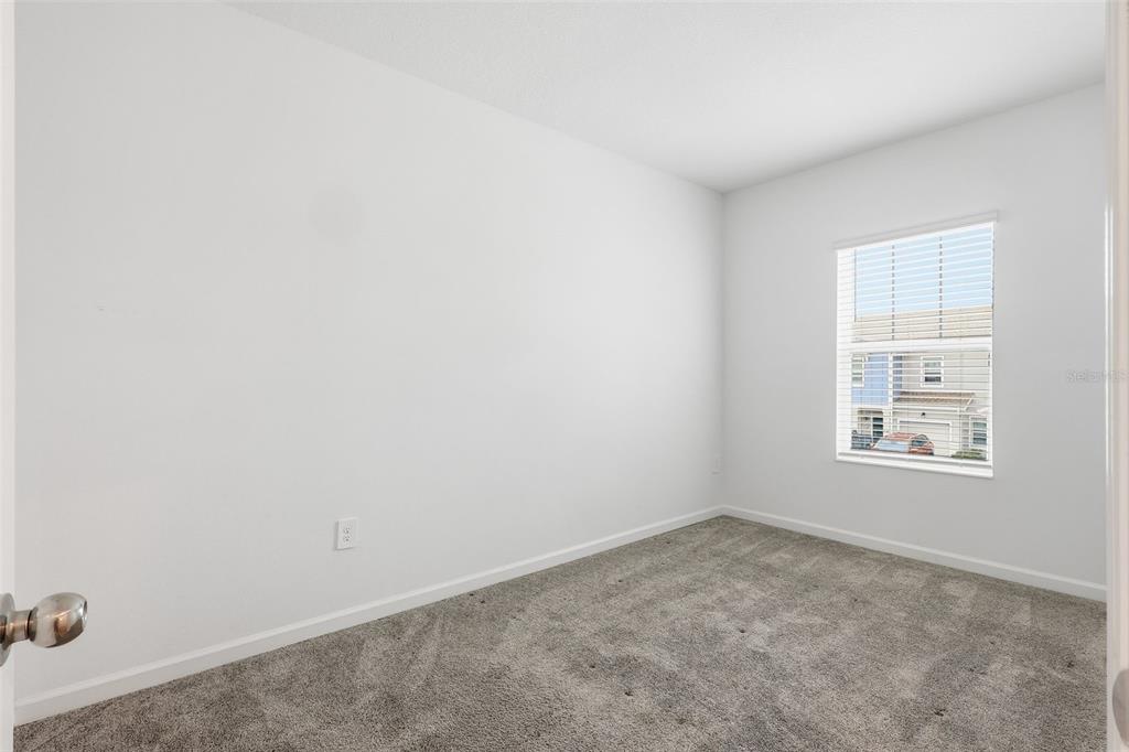 3303 Laurent Loop Davenport, FL 33837 - Photo 24 of 37 an empty room with windows