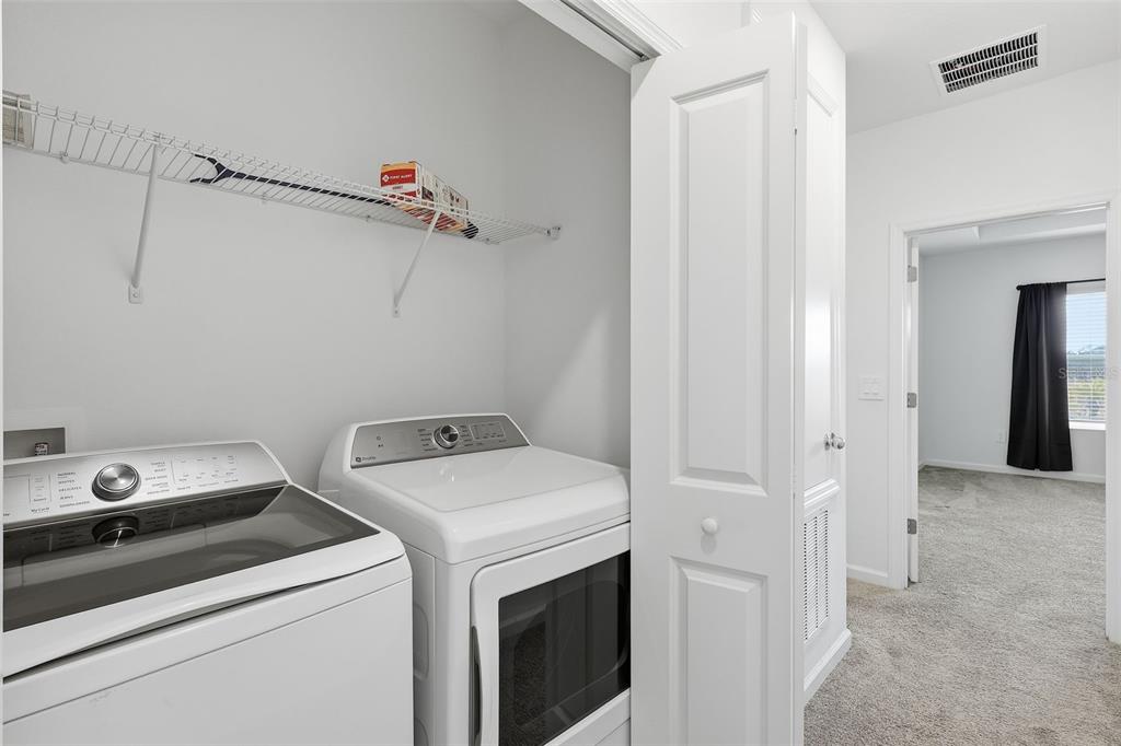 3303 Laurent Loop Davenport, FL 33837 - Photo 25 of 37 a utility room with dryer and washer