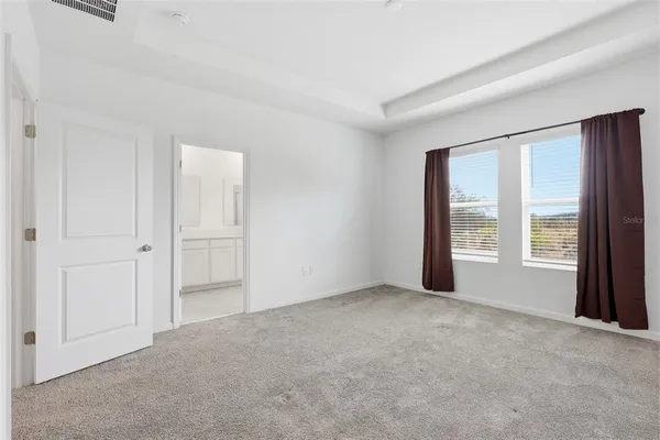 a view of a house with backyard and swimming pool