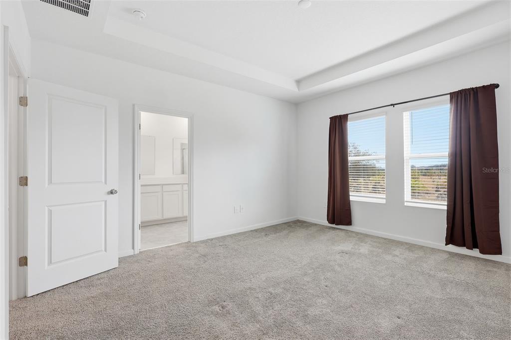3303 Laurent Loop Davenport, FL 33837 - Photo 32 of 37 a view of an empty room with a window