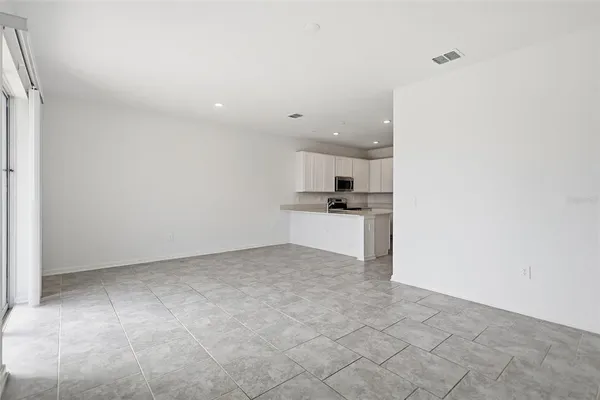 a view of kitchen with wooden floor
