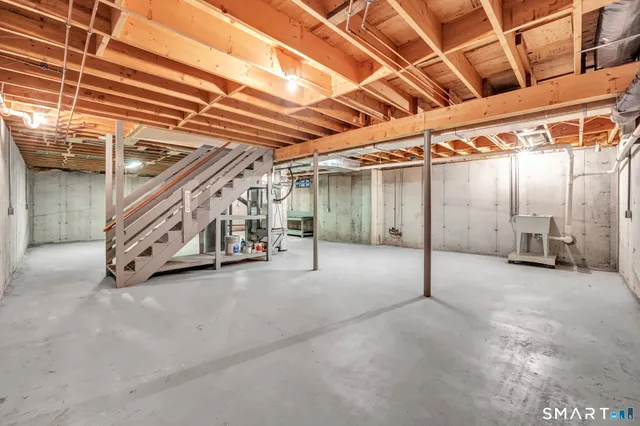 a view of empty room with wooden ceiling