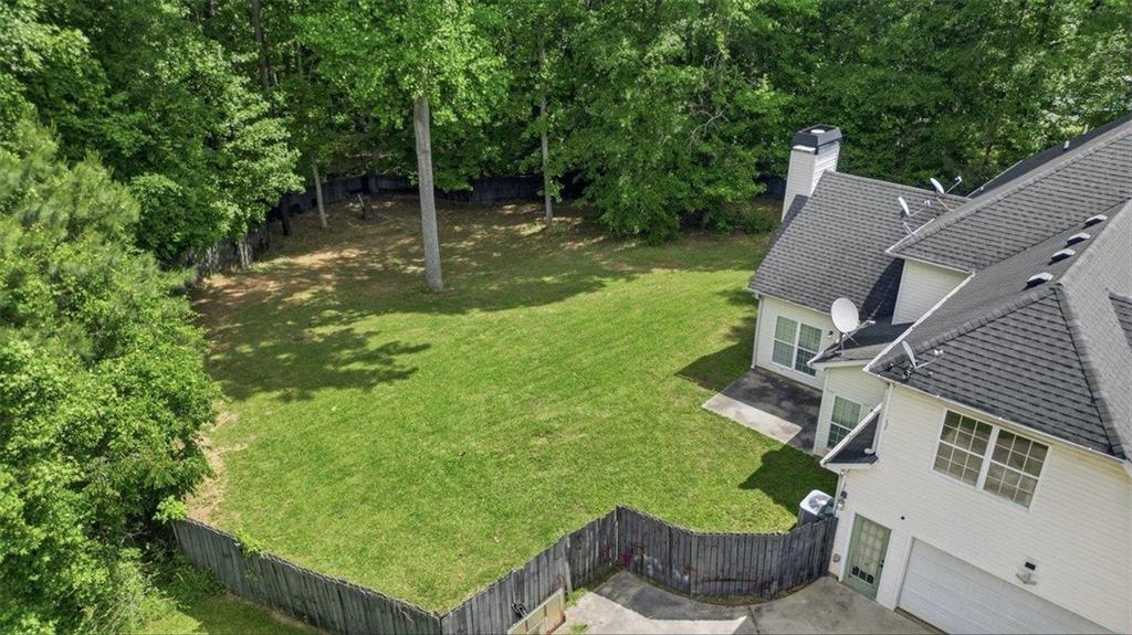 1231 Hillview Road Hampton, GA 30228 - Photo 44 of 49 a view of a backyard with plants and a patio