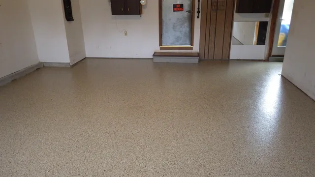 a view of a room that has wooden floor and windows