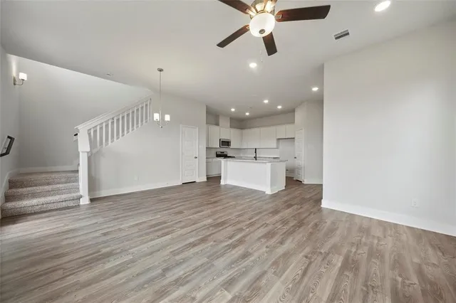 a view of a kitchen with a microwave and a stove