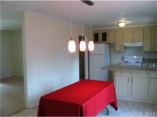 303 Forest Park Road Matthews, NC 28104 - Photo 3 of 13 a bed room with a bed and a potted plant