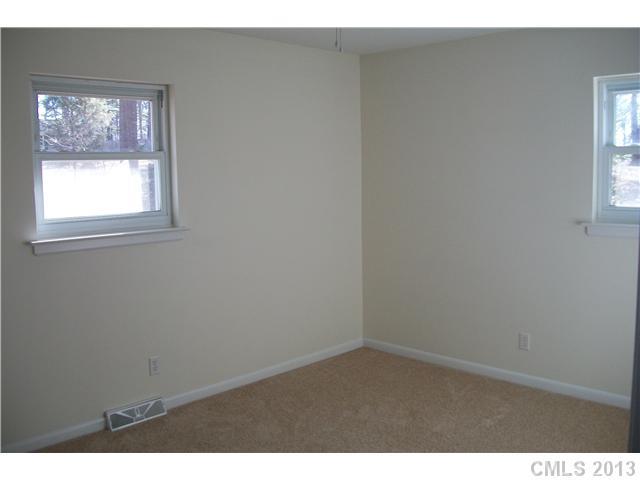 303 Forest Park Road Matthews, NC 28104 - Photo 6 of 13 a view of an empty room with a window