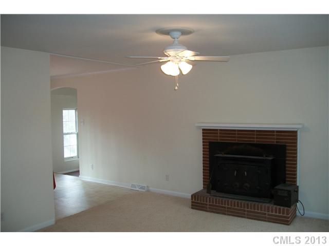 303 Forest Park Road Matthews, NC 28104 - Photo 7 of 13 a living room with a fireplace