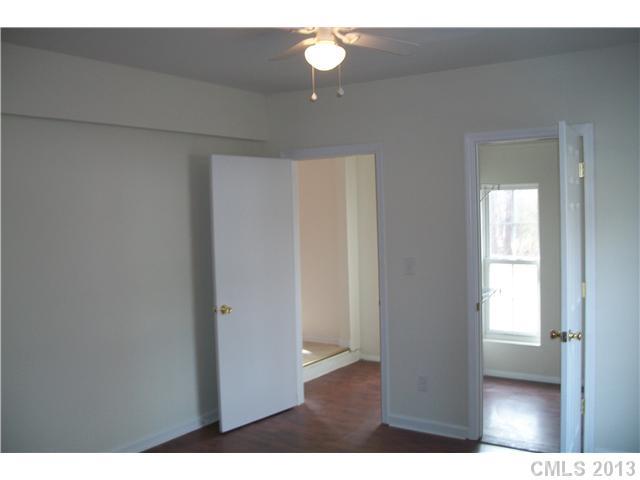 303 Forest Park Road Matthews, NC 28104 - Photo 8 of 13 a view of an empty room and window