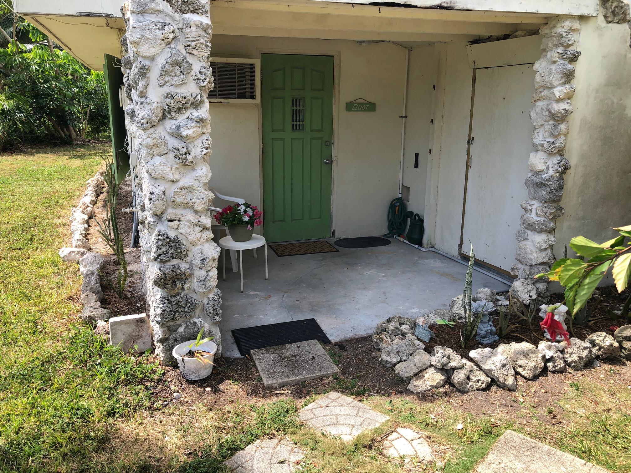 349 Sound Drive Key Largo, FL 33037 - Photo 2 of 16 a view of a chairs and table in backyard