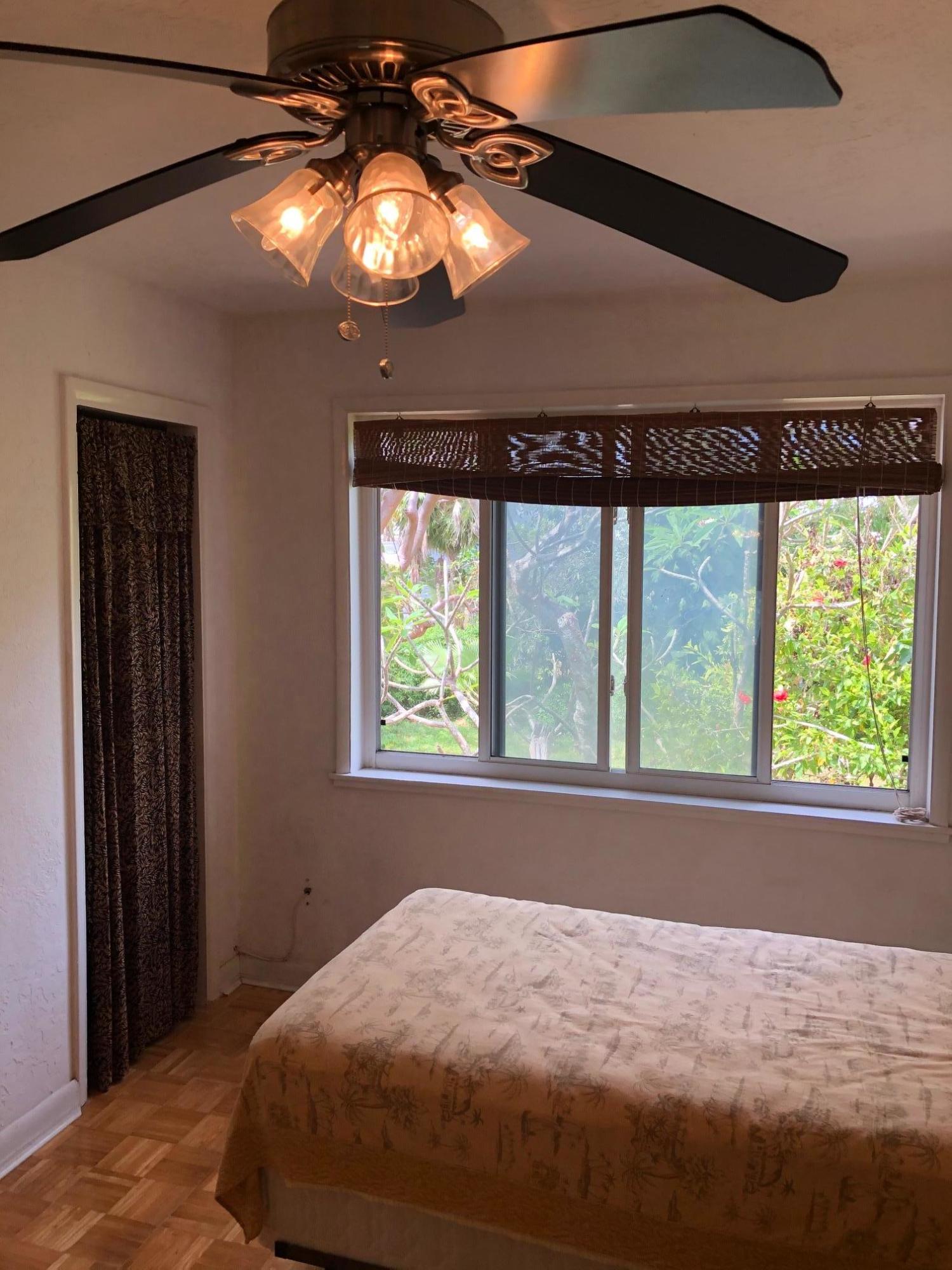 349 Sound Drive Key Largo, FL 33037 - Photo 11 of 16 a bedroom with a bed and a window