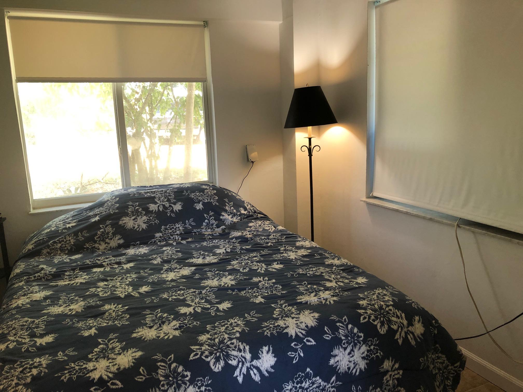 349 Sound Drive Key Largo, FL 33037 - Photo 10 of 16 a bedroom with a bed and a window