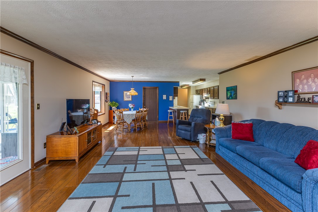 4210 Pleasanton Road Englewood, OH 45322 - Photo 14 of 34 This inviting space features lustrous wood flooring and an open layout, perfect for everyday living.