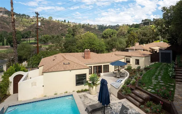 an aerial view of a house with a garden