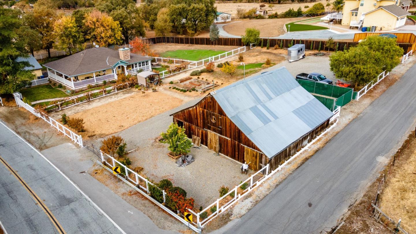 an aerial view of a house with outdoor space and lake view