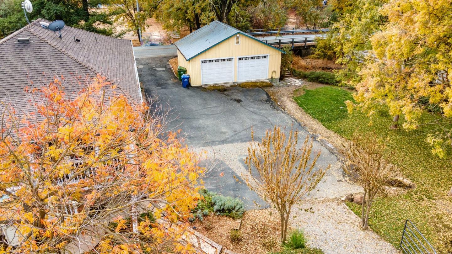 9110 Burchell Road Gilroy, CA 95020 - Photo 14 of 52 a view of backyard with a garden and wooden fence