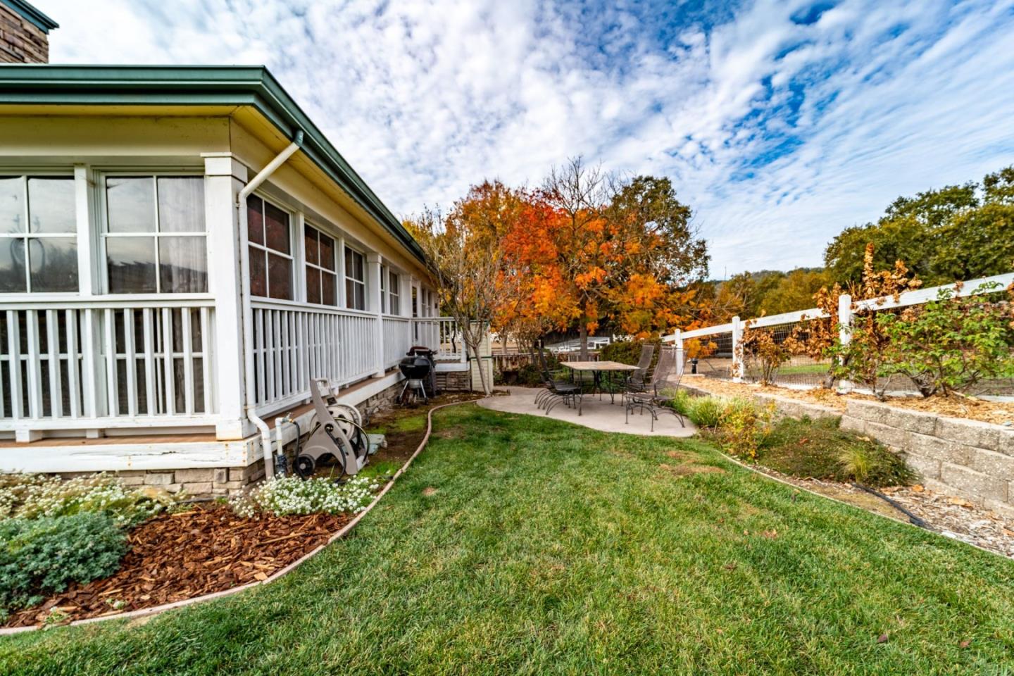 9110 Burchell Road Gilroy, CA 95020 - Photo 17 of 52 a view of a house with backyard sitting area and garden