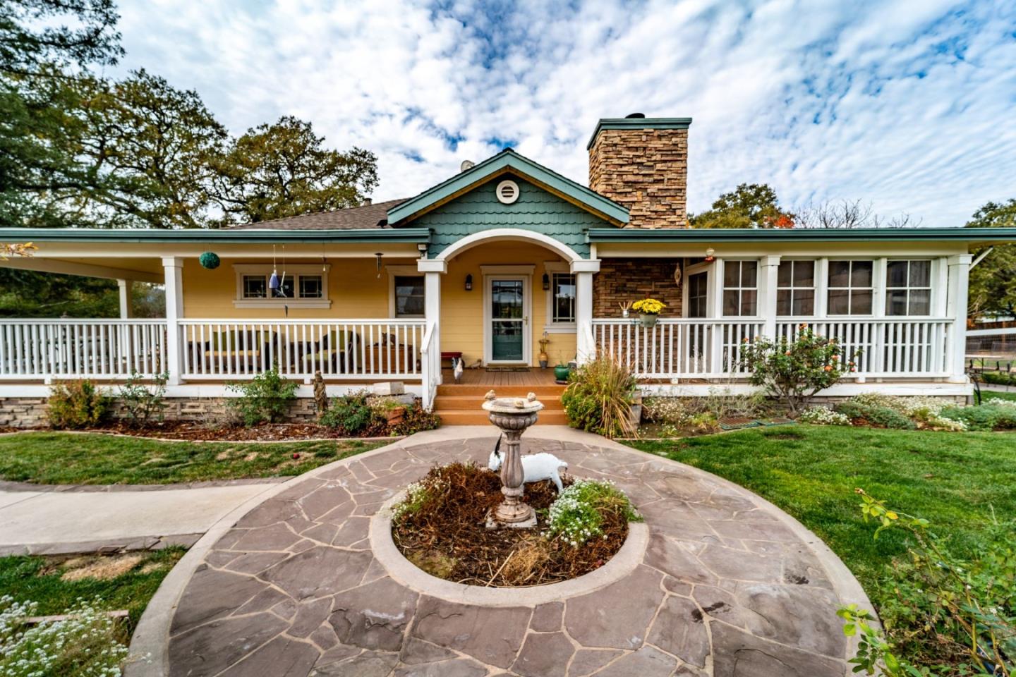 9110 Burchell Road Gilroy, CA 95020 - Photo 24 of 52 a front view of a house with garden