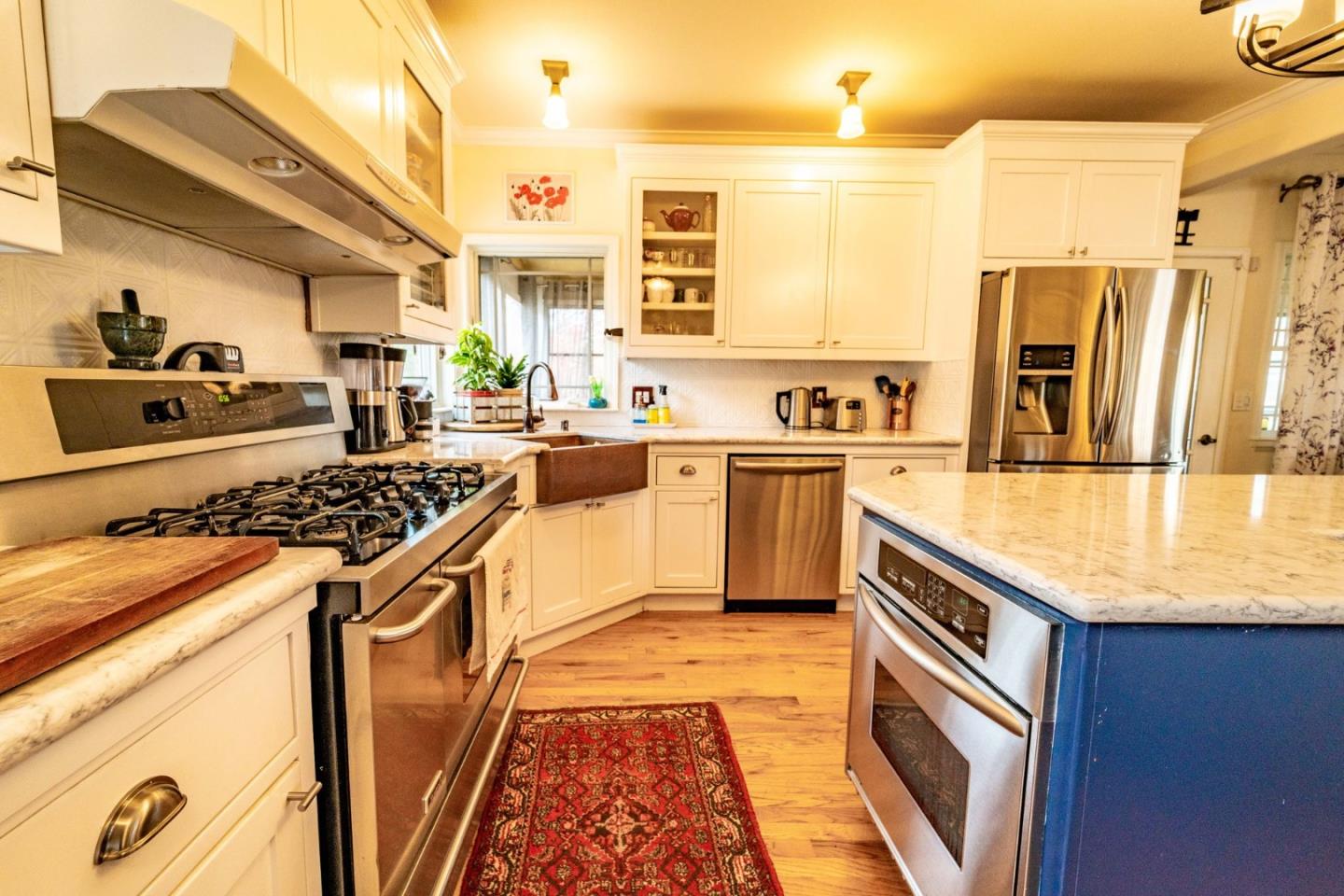 9110 Burchell Road Gilroy, CA 95020 - Photo 34 of 52 a kitchen with stainless steel appliances granite countertop a sink stove and refrigerator